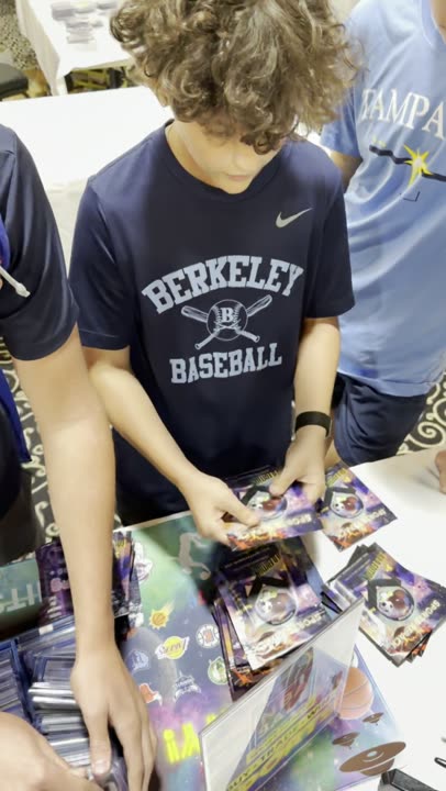 Youth league kid showing off his card